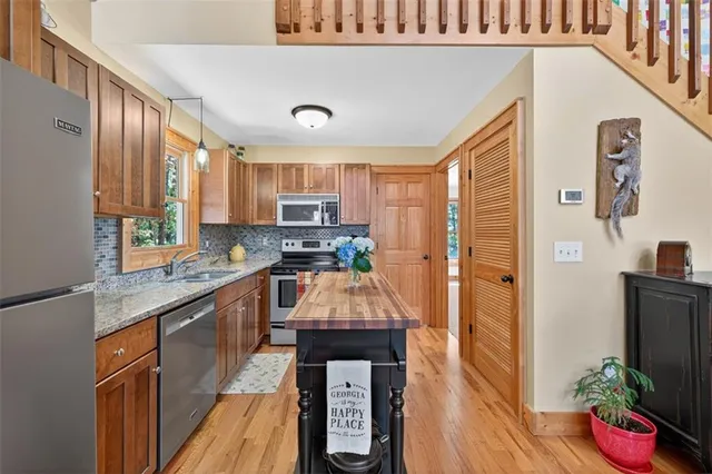a dining room with furniture and a large window