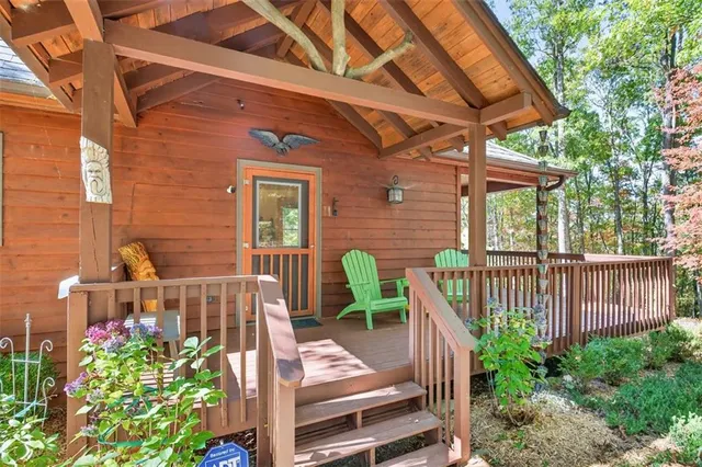 a front view of a house with a yard glass top table and chairs