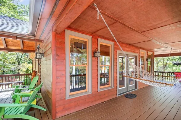 a porch with furniture and garden view