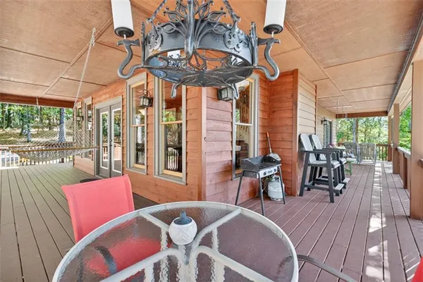 a view of a two chairs in the balcony