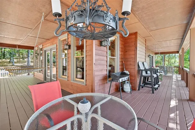 a view of a two chairs in the balcony