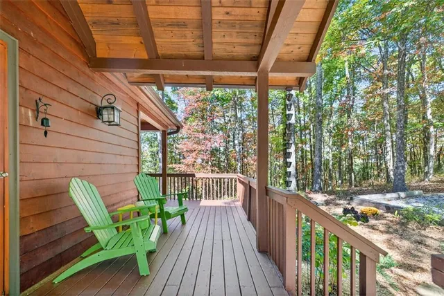 a view of a chair and tables in the balcony