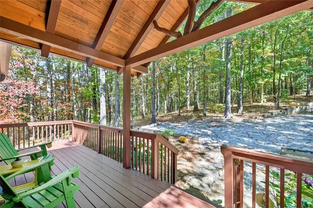 a view of a livingroom with wooden floor and a ceiling fan