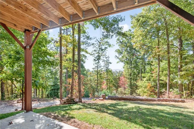 a kitchen with a refrigerator a stove a sink dishwasher and wooden cabinets with wooden floor