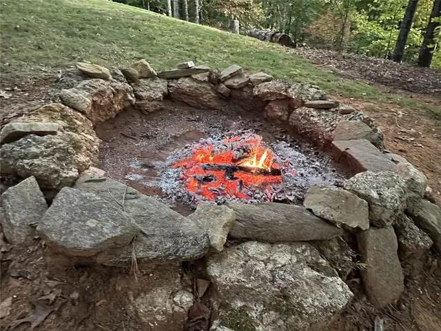 aerial view of a house with a yard and sitting area