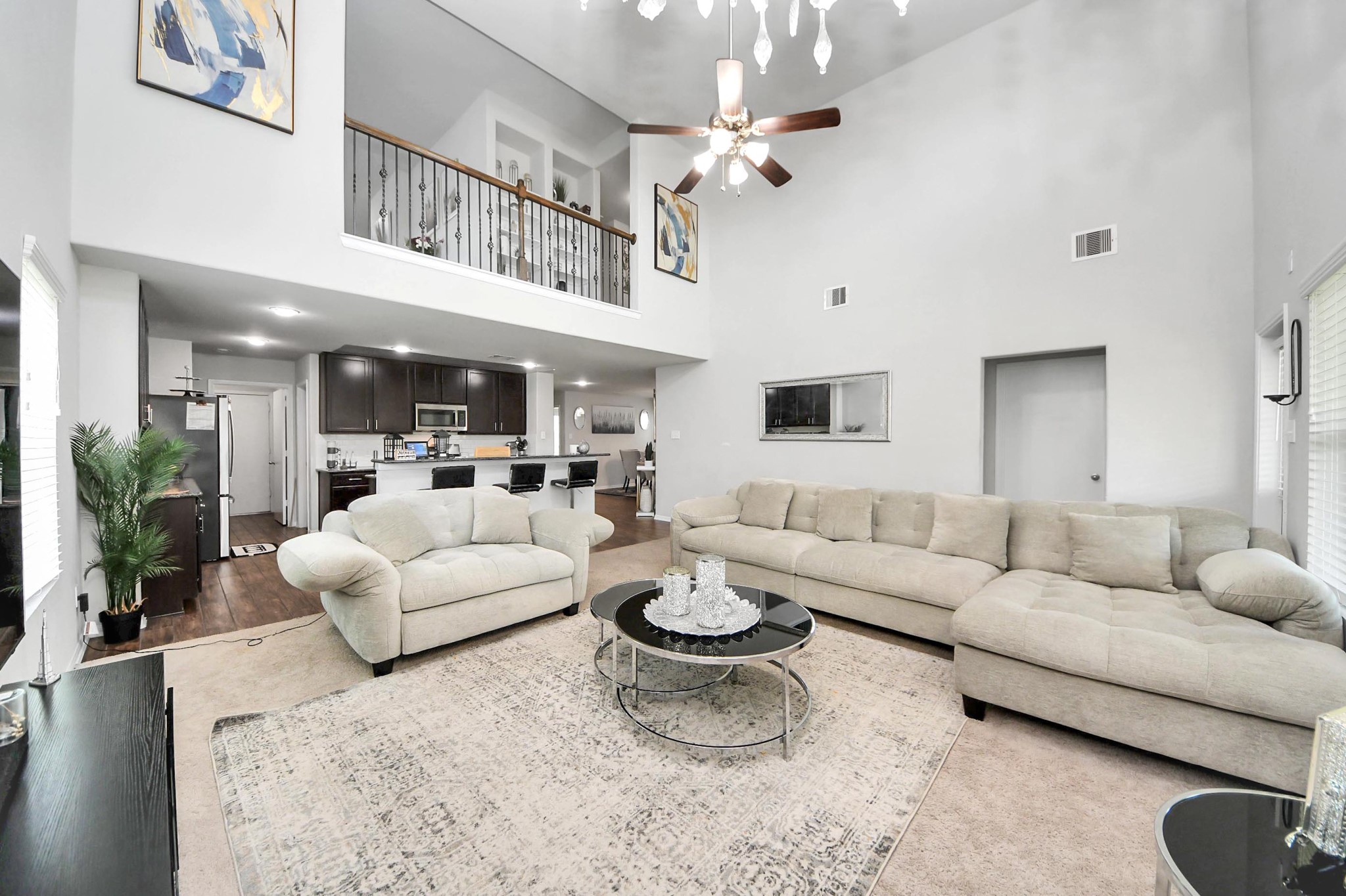 2643 Ridgeback Drive Rosenberg, TX 77471 - Photo 22 of 46 a living room with furniture a rug potted plant and a view of kitchen