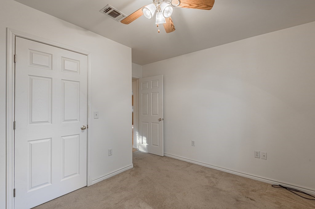 111 Hemlock Road Lufkin, TX 75901 - Photo 26 of 41 an empty room with a chandelier fan