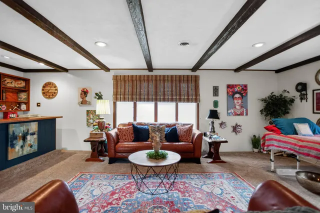 a bathroom with a toilet a sink and a mirror