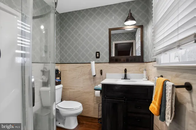 a bedroom with furniture and a fireplace