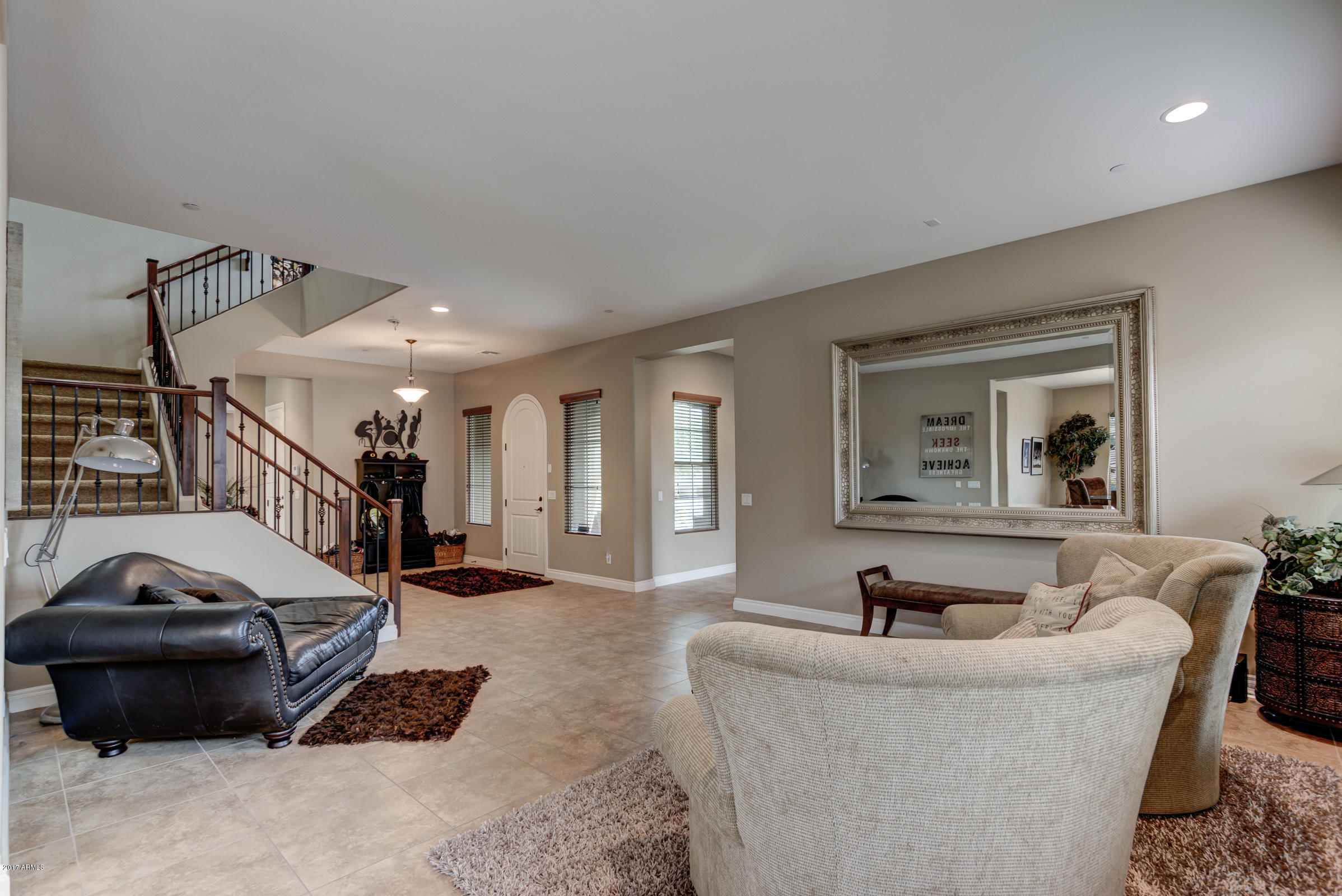 2906 East Blue Sage Road Gilbert, AZ 85297 - Photo 9 of 41 a living room with furniture and a couch