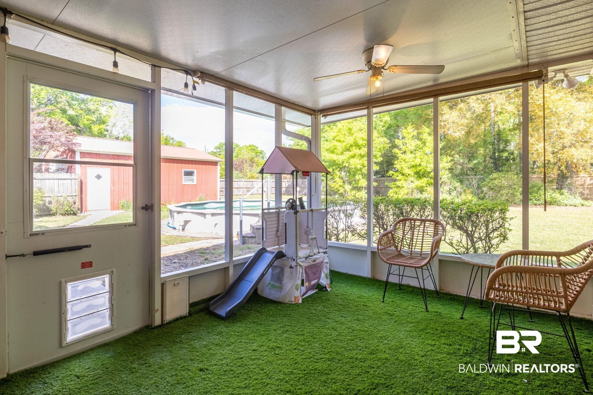 32345 River Lake Road Seminole, AL 36574 - Photo 37 of 56 Sunroom with a ceiling fan and plenty of natural light