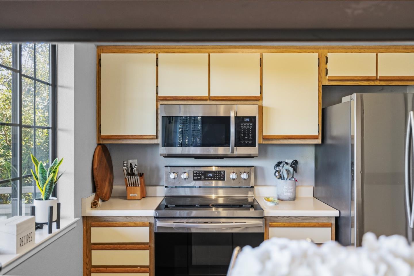 521 Quail Run Court Del Rey Oaks, CA 93940 - Photo 11 of 31 a kitchen with a large window appliances and cabinets
