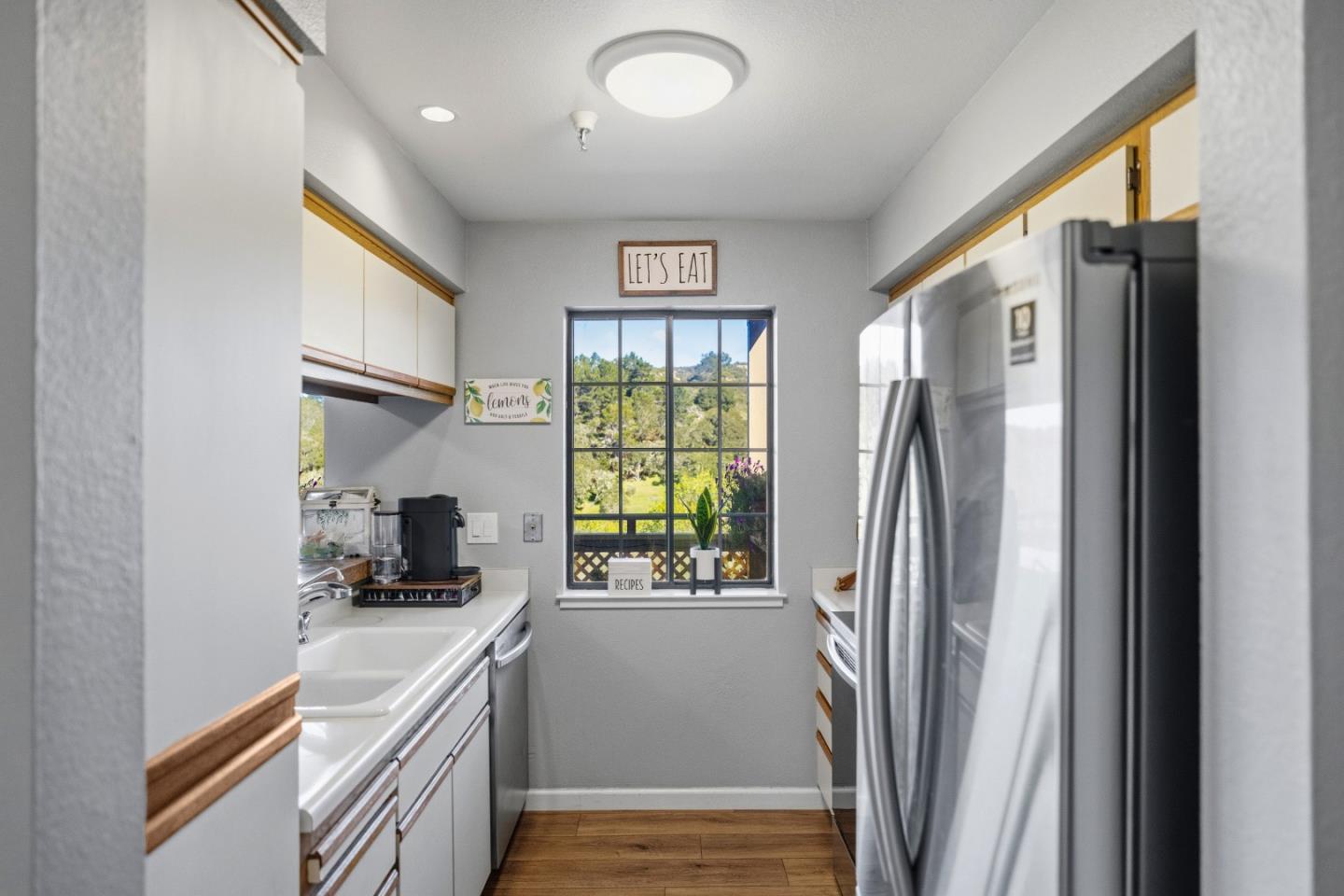 521 Quail Run Court Del Rey Oaks, CA 93940 - Photo 15 of 31 a kitchen with stainless steel appliances granite countertop a refrigerator and a sink