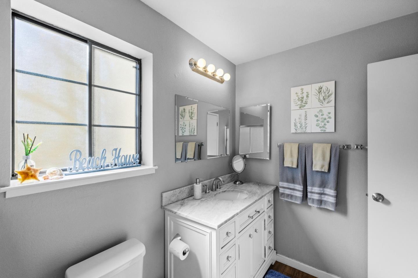 521 Quail Run Court Del Rey Oaks, CA 93940 - Photo 22 of 31 a bathroom with a sink a toilet and a window