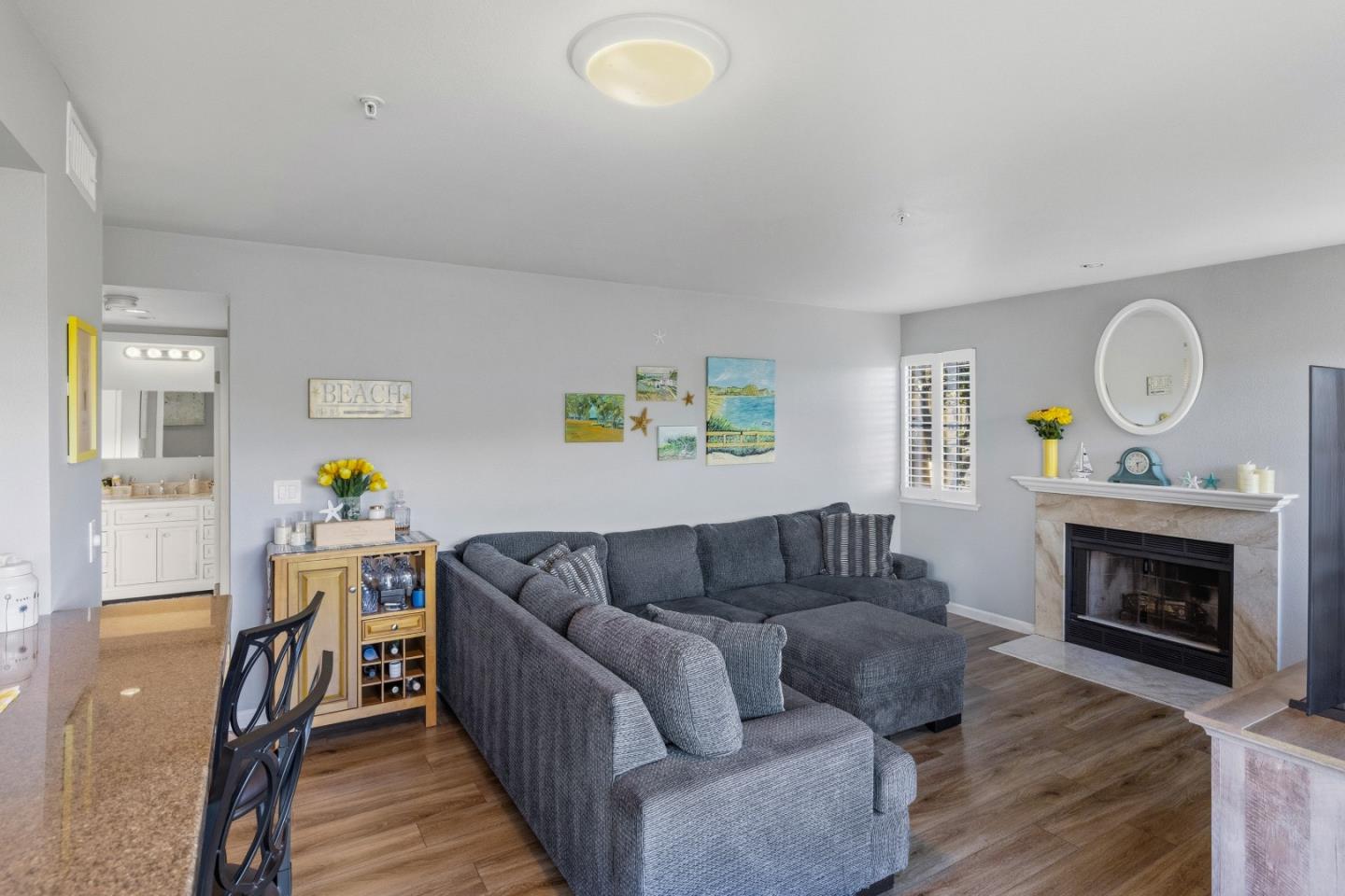 521 Quail Run Court Del Rey Oaks, CA 93940 - Photo 8 of 31 a living room with furniture and a fireplace