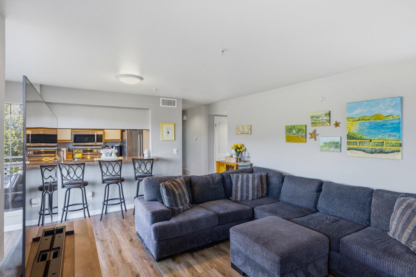 521 Quail Run Court Del Rey Oaks, CA 93940 - Photo 9 of 31 a living room with furniture and kitchen view