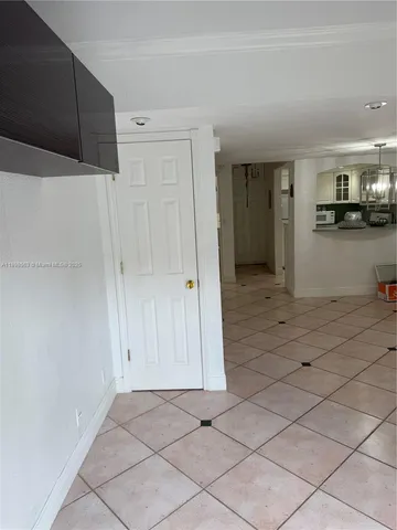 a living room with couches a rug and a window