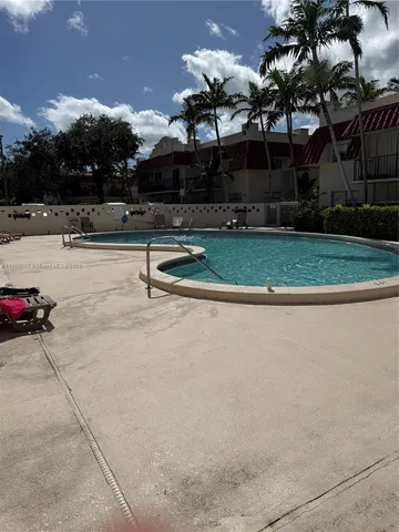a room with wooden floor and a window