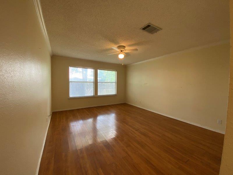 1903 Balsam Way Round Rock, TX 78665 - Photo 8 of 21 Rich hardwood floors complement this spacious room with abundant natural light.