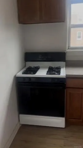 a stove top oven sitting inside of a kitchen