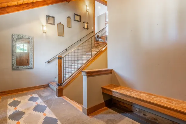 a view of entryway and hall with wooden floor
