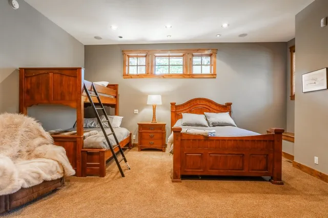 a bedroom with furniture and a gym equipment