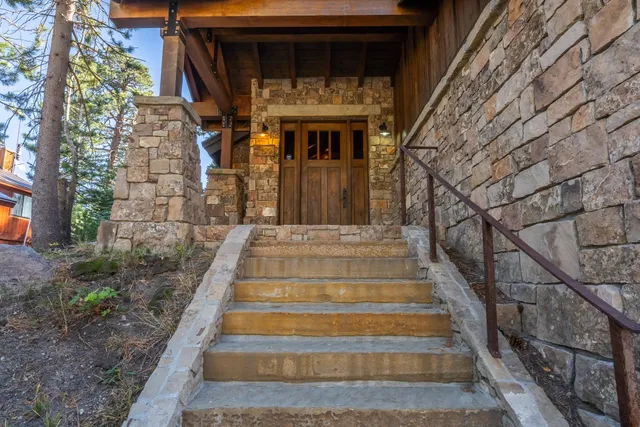 a front view of a house with stairs