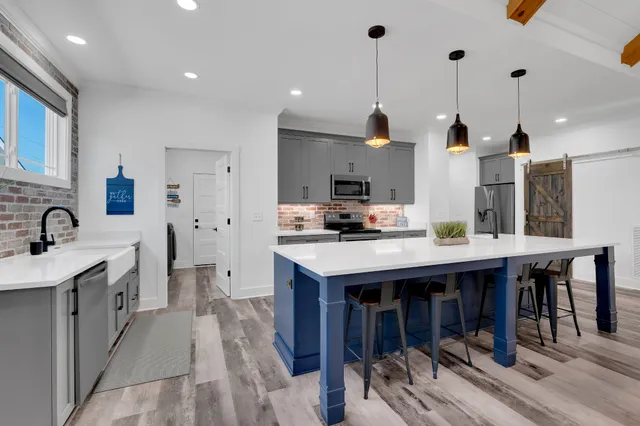 a view of a hallway with a washer and dryer