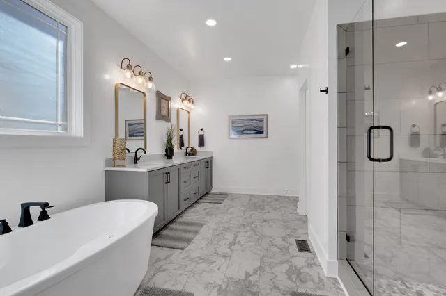 a view of walk in closet with clothes