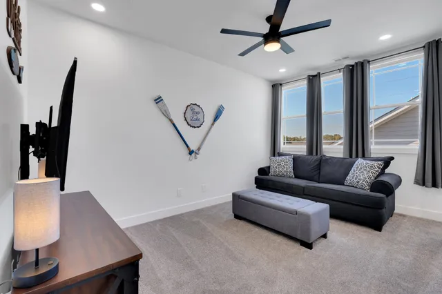 a spacious bedroom with two beds and painted walls