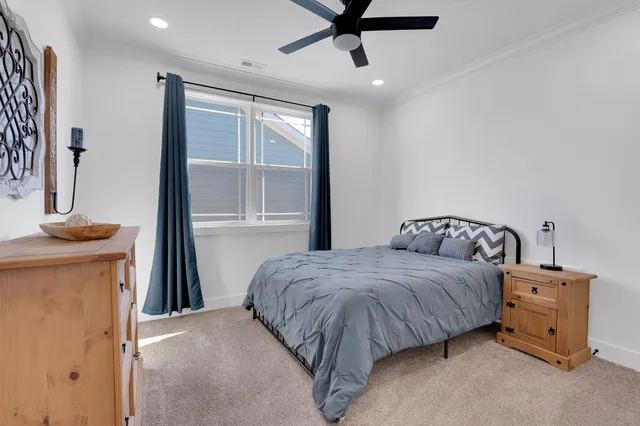 a view of a balcony with two chairs and a table