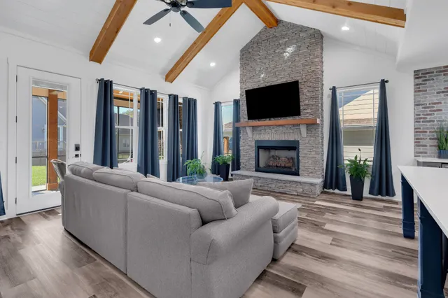 a living room with furniture and a fireplace