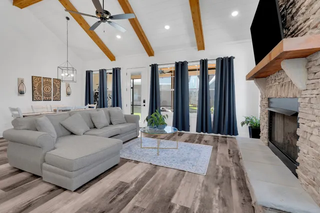 a kitchen with stainless steel appliances granite countertop a sink and a stove top oven