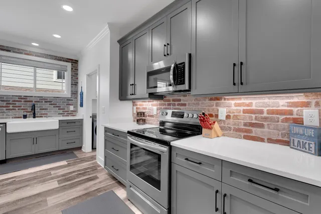 a view of a livingroom with furniture window and wooden floor