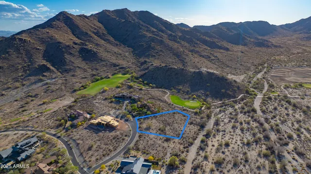 a aerial view of house with mountain view