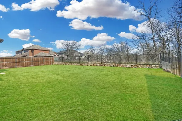 a view of a lake with a big yard