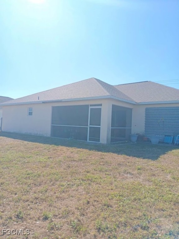 1017 Nelson Road North Cape Coral, FL 33993 - Photo 5 of 9 a house with yard in front of it