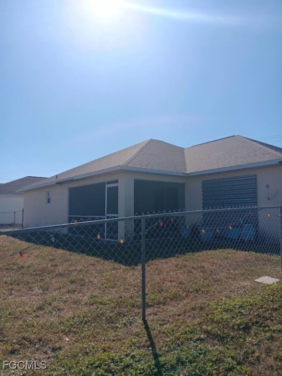 1017 Nelson Road North Cape Coral, FL 33993 - Photo 7 of 9 a front view of a house with a yard