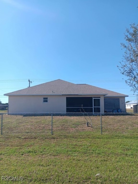1017 Nelson Road North Cape Coral, FL 33993 - Photo 8 of 9 a view of a house with a yard