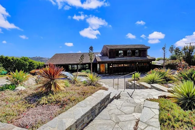 a view of a chairs and table in the patio