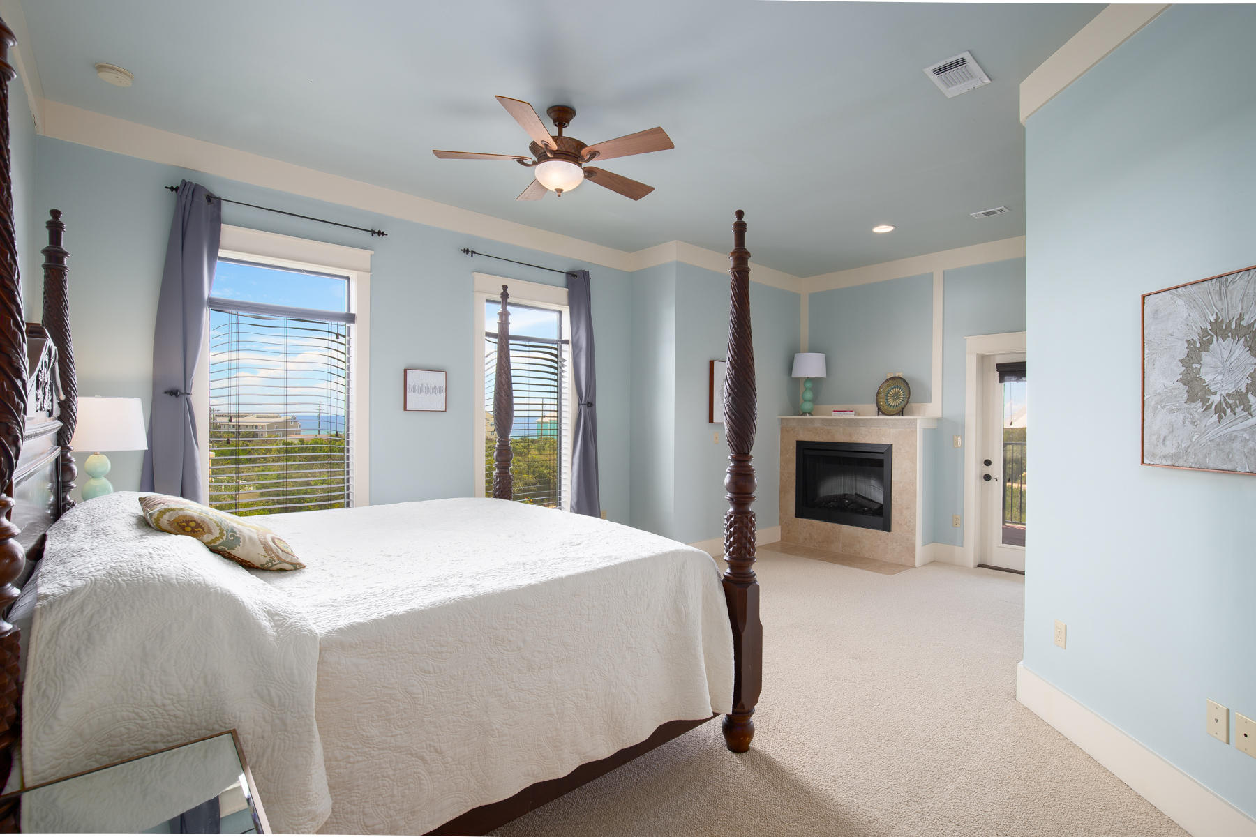 59 Baird Road Santa Rosa Beach, FL 32459 - Photo 11 of 24 a spacious bedroom with a large bed and a chandelier