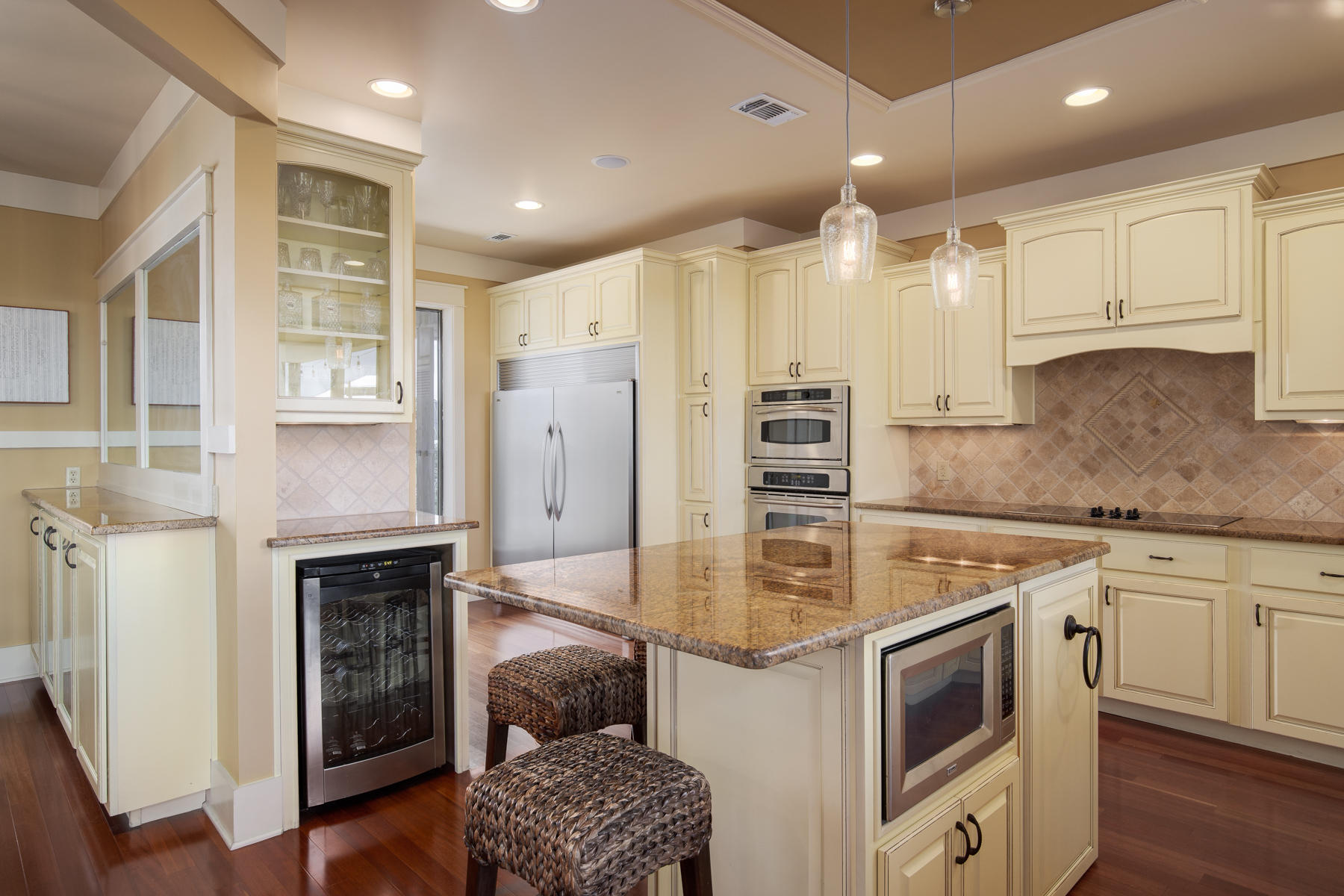59 Baird Road Santa Rosa Beach, FL 32459 - Photo 8 of 24 a kitchen with stainless steel appliances granite countertop a stove and a refrigerator