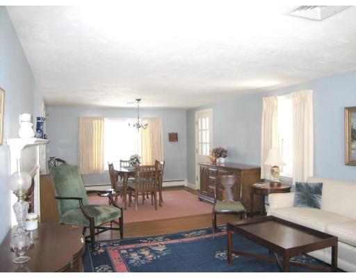 72 Gleason Road Reading, MA 01867 - Photo 3 of 9 a living room with fireplace furniture and a large window
