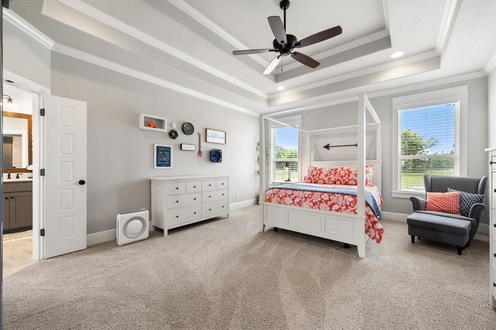 6425 Starlight Ranch Road Godley, TX 76044 - Photo 21 of 37 This large primary bedroom features triple trey ceiling, cased windows, crown molding