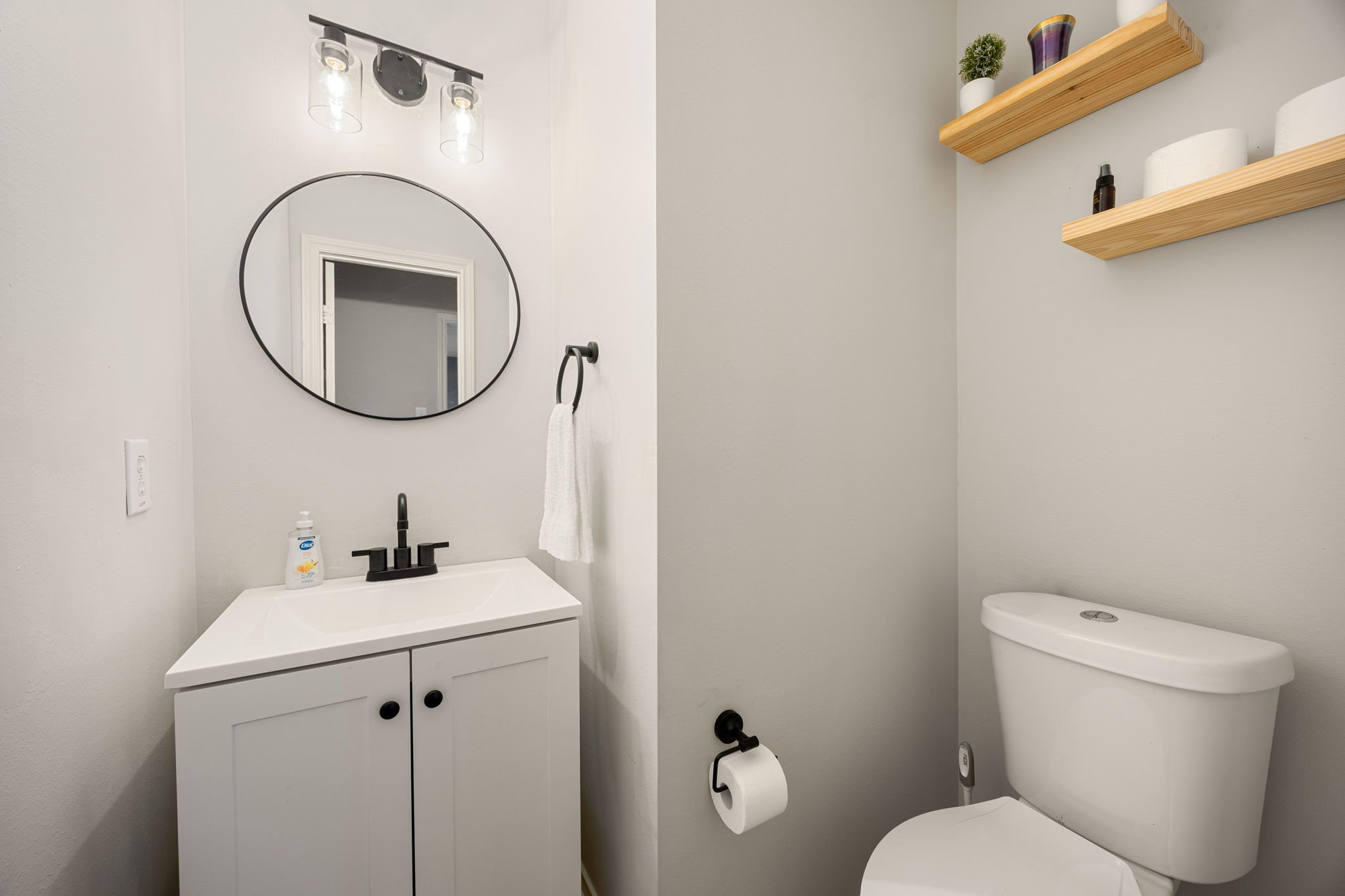 3707 Pecan Court Manvel, TX 77578 - Photo 16 of 35 a bathroom with a toilet sink and mirror