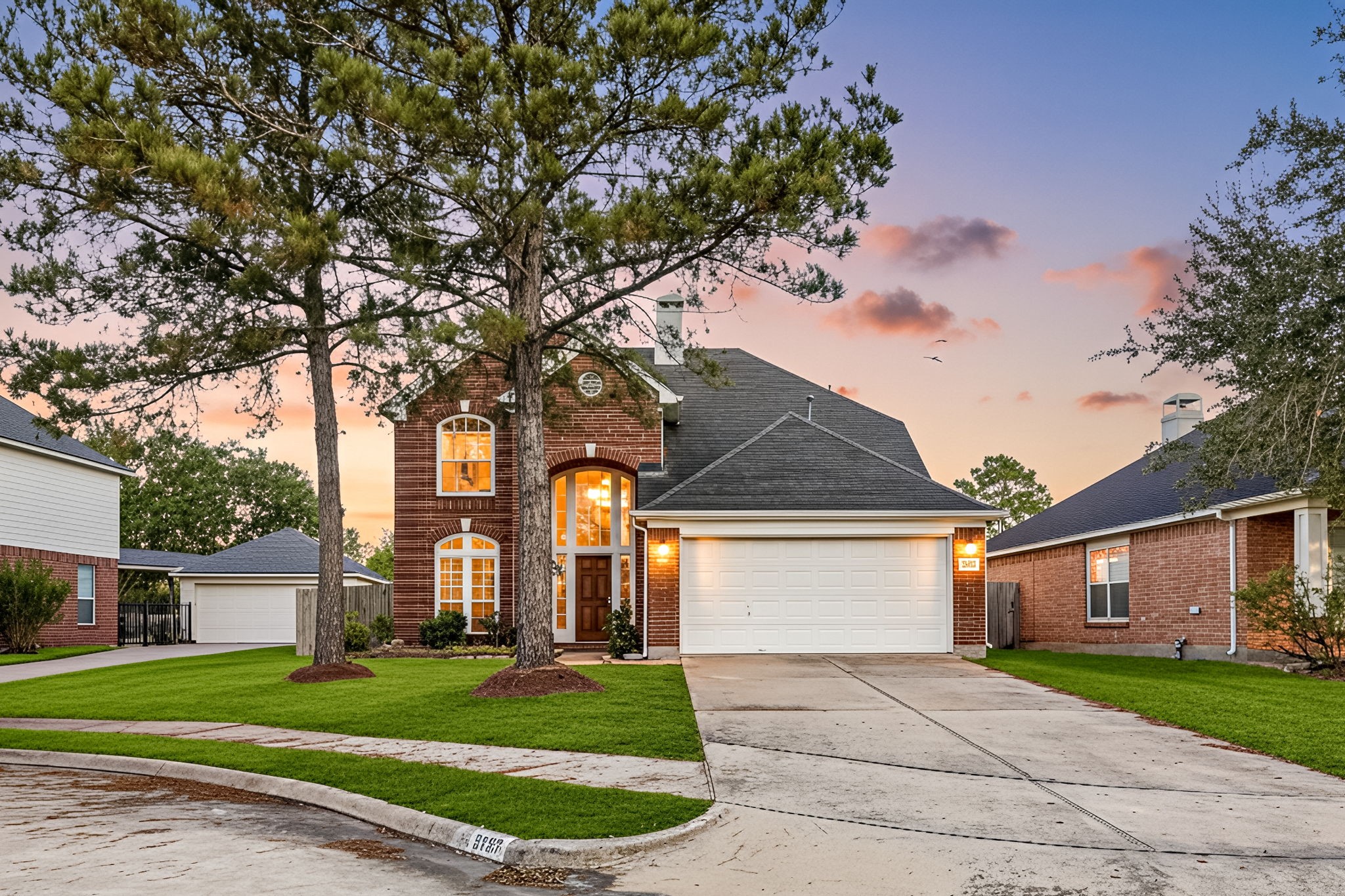 3707 Pecan Court Manvel, TX 77578 - Photo 30 of 35 a front view of a house with a yard and garage
