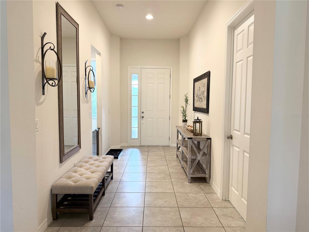 1099 Nathan Ridge Road Clermont, FL 34715 - Photo 2 of 21 a living room with furniture and a flat screen tv