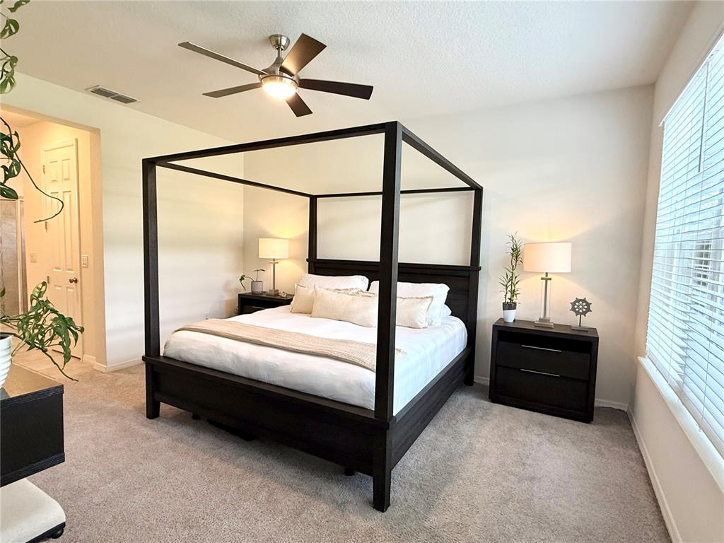 1099 Nathan Ridge Road Clermont, FL 34715 - Photo 6 of 21 a bedroom with a bed and window