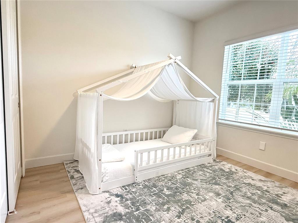 1099 Nathan Ridge Road Clermont, FL 34715 - Photo 10 of 21 a bedroom with a bed and a window