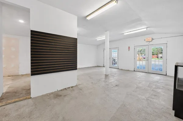 a view of an empty room with windows